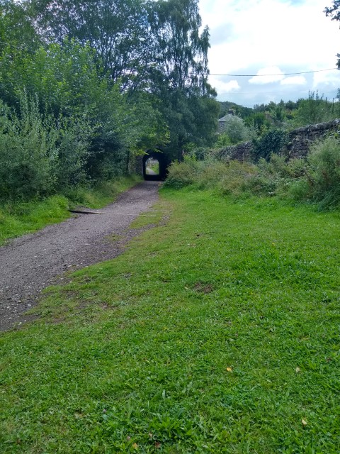 A photo showing a long stone tunnel.