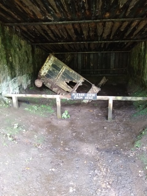 A photo showing an old and broken wagon in the catch pit.