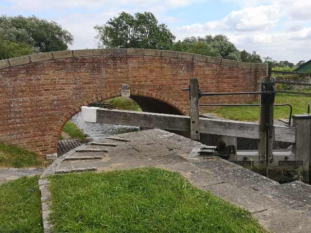 A red-brick bridge spanning the canal.