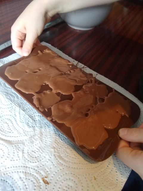 A photo of the mould being shaken to get the air bubbles to the surface.