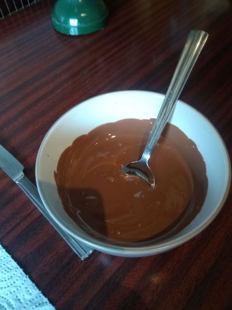 A photo of the brown chocolate in a bowl.